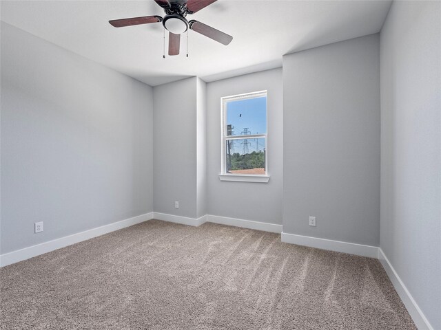 6221 Post Oak Ter, Fort Worth, TX 76112 - empty room with light carpet, a ceiling fan, and baseboards