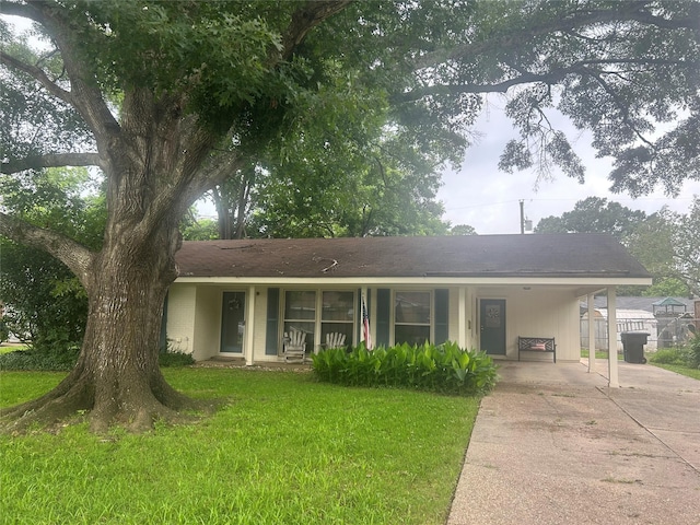 3415 Reily Ln, Shreveport, LA 71105 - view of front of home featuring driveway, a carport, and covered porch