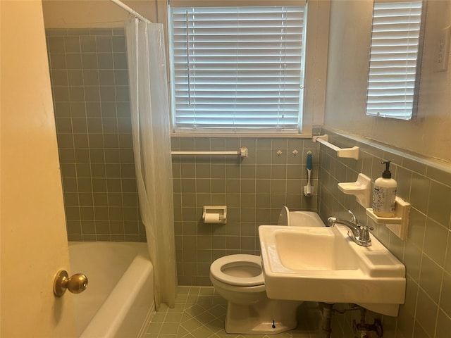 3415 Reily Ln, Shreveport, LA 71105 - bathroom with tile patterned flooring, toilet, a sink, shower / bath combo, and tile walls