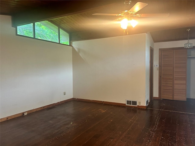3415 Reily Ln, Shreveport, LA 71105 - spare room with dark wood-style flooring, vaulted ceiling, a ceiling fan, baseboards, and wooden ceiling