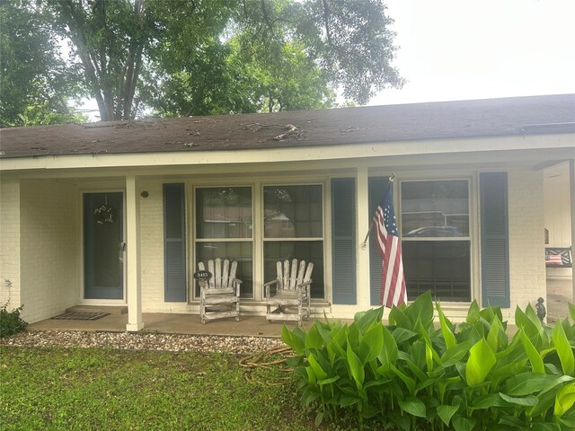 3415 Reily Ln, Shreveport, LA 71105 - property entrance with brick siding and covered porch