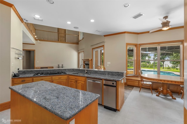 135 Oak Leaf Trl, Benton, LA 71006 - kitchen with a sink, dishwasher, black gas cooktop, recessed lighting, and dark stone counters
