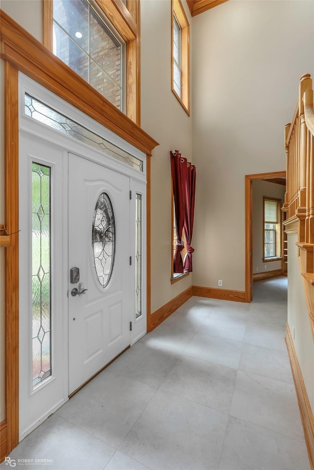 135 Oak Leaf Trl, Benton, LA 71006 - entrance foyer with baseboards and a towering ceiling