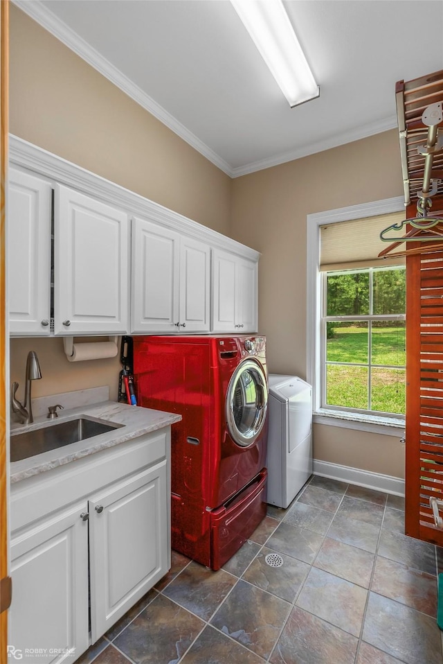 135 Oak Leaf Trl, Benton, LA 71006 - laundry area with cabinet space, washer and dryer, crown molding, baseboards, and dark stone finish flooring