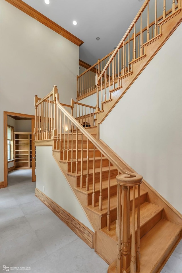 135 Oak Leaf Trl, Benton, LA 71006 - stairs with recessed lighting, a towering ceiling, and baseboards