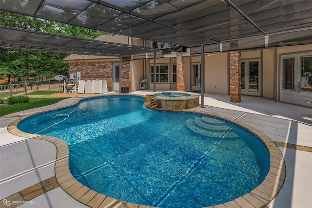 135 Oak Leaf Trl, Benton, LA 71006 - view of pool with fence, a patio, french doors, a pool with connected hot tub, and a pergola
