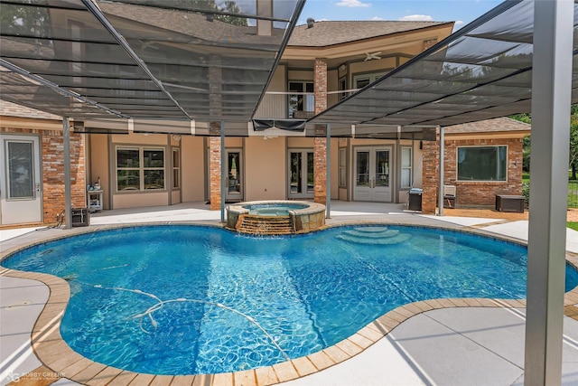 135 Oak Leaf Trl, Benton, LA 71006 - view of swimming pool with french doors, a patio area, ceiling fan, and a pool with connected hot tub