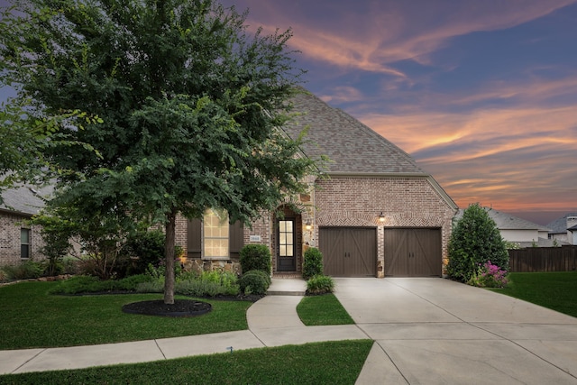 3940 White Clover Ln, Prosper, TX 75078 - view of front of house featuring brick siding, concrete driveway, an attached garage, and a shingled roof