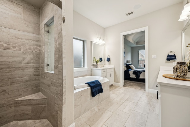 3940 White Clover Ln, Prosper, TX 75078 - ensuite bathroom featuring a garden tub, vanity, and a walk in shower