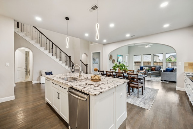 3940 White Clover Ln, Prosper, TX 75078 - kitchen with dishwasher, arched walkways, open floor plan, a sink, and dark wood-style floors