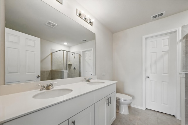 1611 Timpson Dr, Forney, TX 75126 - bathroom featuring a shower stall, toilet, double vanity, tile patterned floors, and baseboards