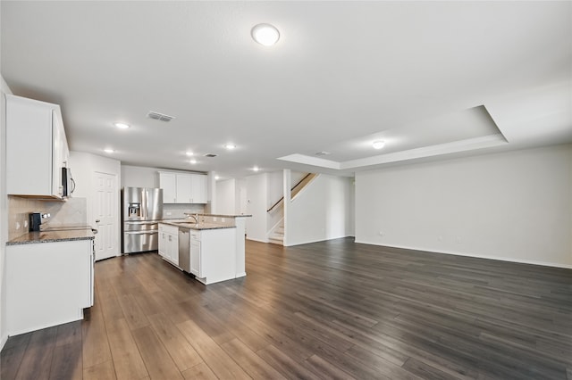 1611 Timpson Dr, Forney, TX 75126 - kitchen with stainless steel appliances, open floor plan, a sink, decorative backsplash, and recessed lighting