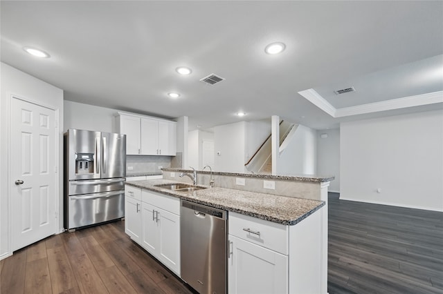 1611 Timpson Dr, Forney, TX 75126 - kitchen featuring stainless steel appliances, a sink, ornamental molding, dark wood-style flooring, and an island with sink