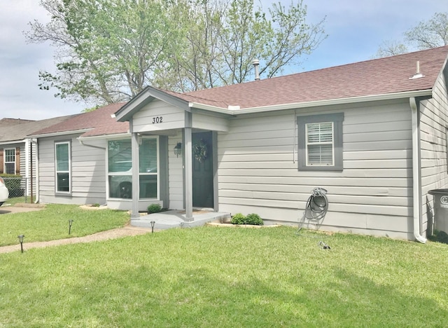 302 N 1st St, Wylie, TX 75098 - ranch-style house featuring a front yard and a shingled roof