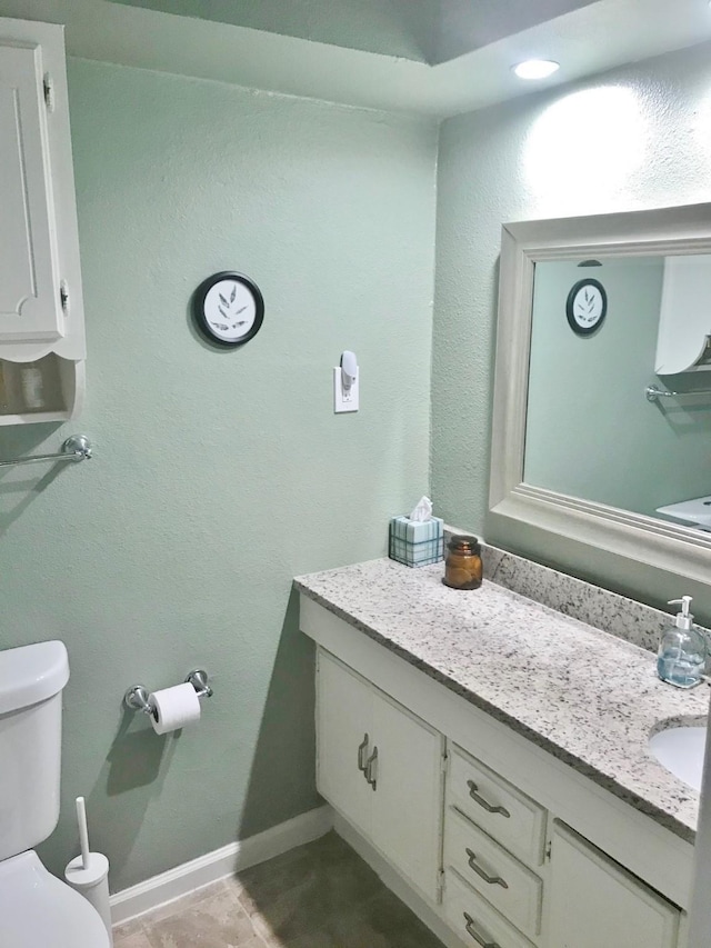 302 N 1st St, Wylie, TX 75098 - bathroom with toilet, vanity, and baseboards