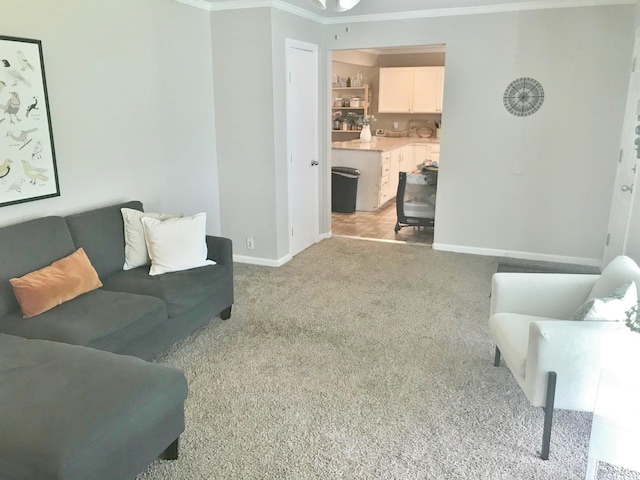 302 N 1st St, Wylie, TX 75098 - living area featuring crown molding, baseboards, and light colored carpet