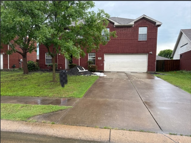1005 Bainbridge Ln, Forney, TX 75126 - traditional-style house with a garage, driveway, and brick siding