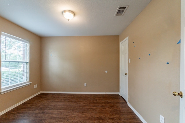 1005 Bainbridge Ln, Forney, TX 75126 - empty room with dark wood-style floors and baseboards