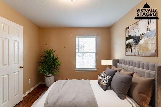 1005 Bainbridge Ln, Forney, TX 75126 - bedroom with dark wood-style flooring and baseboards