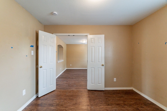 1005 Bainbridge Ln, Forney, TX 75126 - empty room featuring wood finished floors, a smoke detector, and baseboards