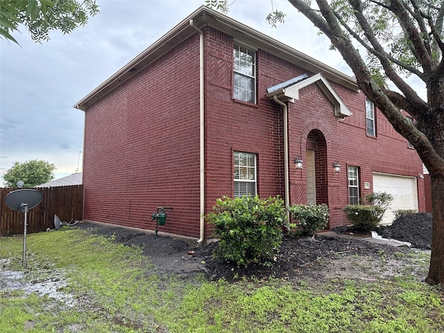 1005 Bainbridge Ln, Forney, TX 75126 - view of front of house featuring fence, brick siding, and a garage