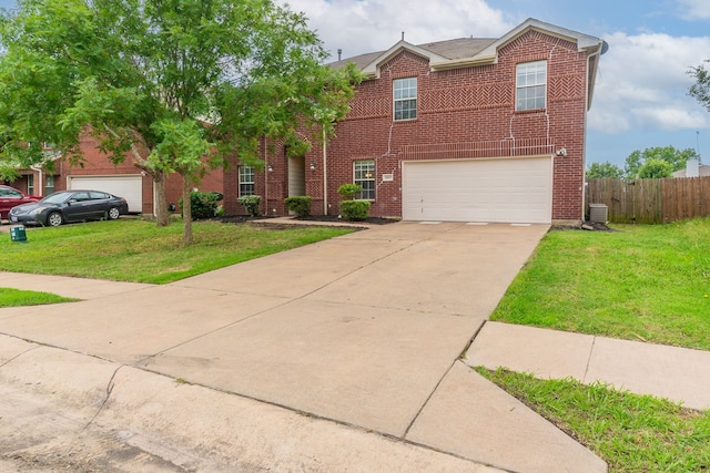 1005 Bainbridge Ln, Forney, TX 75126 - traditional home featuring an attached garage, brick siding, and driveway