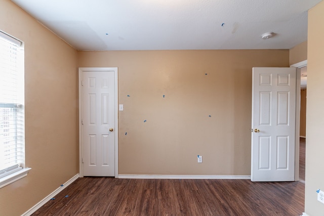 1005 Bainbridge Ln, Forney, TX 75126 - spare room with wood finished floors, baseboards, and a smoke detector