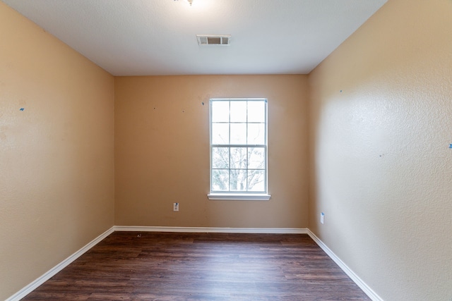 1005 Bainbridge Ln, Forney, TX 75126 - unfurnished room with dark wood-type flooring and baseboards