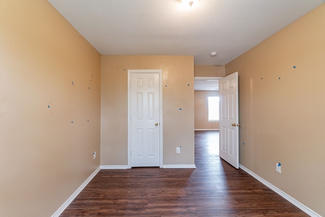 1005 Bainbridge Ln, Forney, TX 75126 - empty room featuring dark wood-style flooring and baseboards
