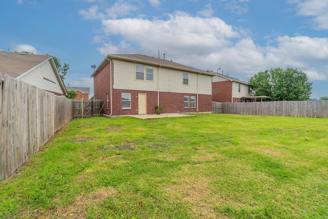 1005 Bainbridge Ln, Forney, TX 75126 - rear view of house featuring brick siding and a patio area