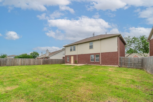 1005 Bainbridge Ln, Forney, TX 75126 - rear view of property featuring brick siding and a patio