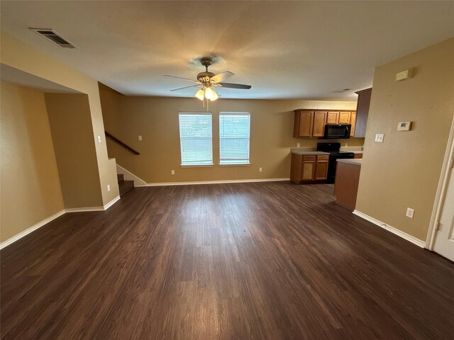 1005 Bainbridge Ln, Forney, TX 75126 - unfurnished living room featuring dark wood-type flooring, baseboards, stairs, and ceiling fan