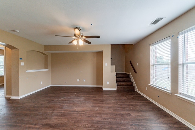 1005 Bainbridge Ln, Forney, TX 75126 - unfurnished living room with ceiling fan, plenty of natural light, stairs, and wood finished floors
