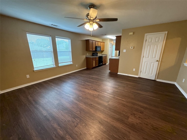 1005 Bainbridge Ln, Forney, TX 75126 - unfurnished living room featuring ceiling fan, dark wood-style flooring, and baseboards