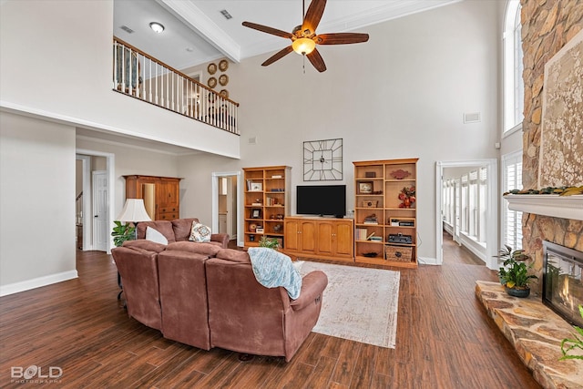 10198 Castanedo Ct, Keithville, LA 71047 - living area featuring a high ceiling, ceiling fan, a fireplace, dark wood-type flooring, and baseboards