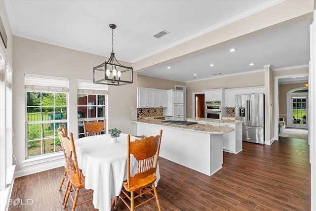 10198 Castanedo Ct, Keithville, LA 71047 - dining room featuring recessed lighting, ornamental molding, a chandelier, dark wood-style floors, and baseboards