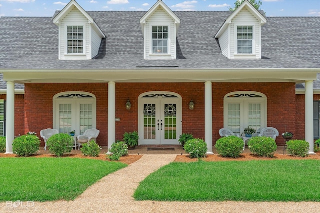 10198 Castanedo Ct, Keithville, LA 71047 - cape cod home with covered porch, brick siding, and roof with shingles