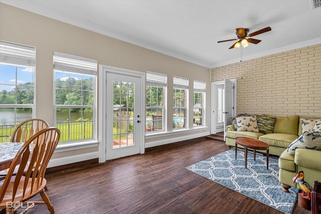 10198 Castanedo Ct, Keithville, LA 71047 - sunroom with brick wall, wood finished floors, ornamental molding, a wooden deck, and baseboards