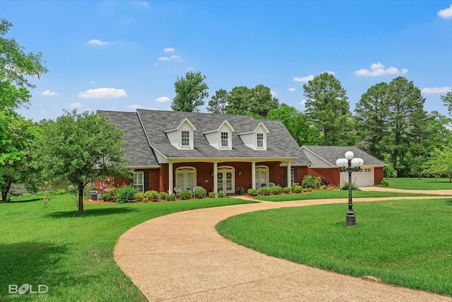 10198 Castanedo Ct, Keithville, LA 71047 - cape cod house with french doors, curved driveway, a front lawn, and brick siding