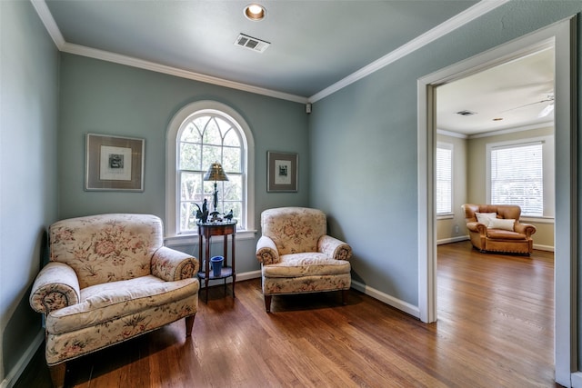 4317 Rawlins St, Dallas, TX 75219 - living area featuring plenty of natural light, ornamental molding, wood finished floors, and baseboards