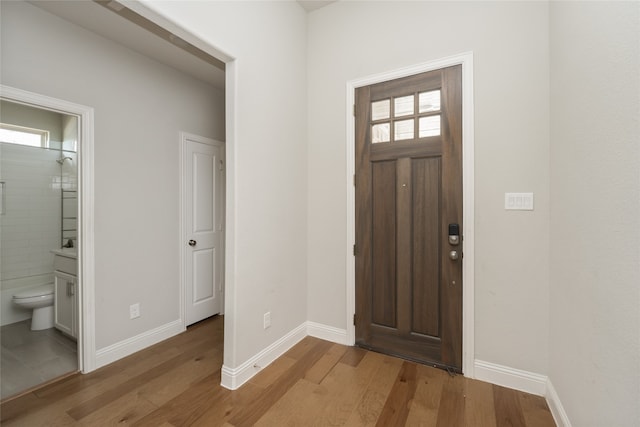 2614 Dakota Cir, Corinth, TX 76210 - foyer featuring plenty of natural light, light wood-style flooring, and baseboards