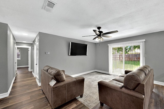 6912 Griggs St, Forest Hill, TX 76140 - living area with baseboards, a textured ceiling, dark wood finished floors, and ceiling fan
