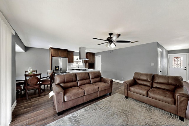 6912 Griggs St, Forest Hill, TX 76140 - living area featuring dark wood finished floors, baseboards, and ceiling fan