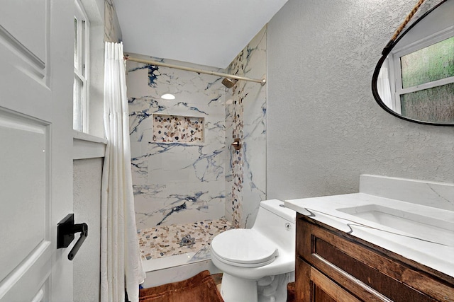 6912 Griggs St, Forest Hill, TX 76140 - full bath featuring a textured wall, a marble finish shower, toilet, and vanity