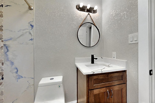 6912 Griggs St, Forest Hill, TX 76140 - bathroom featuring vanity, toilet, and a textured wall