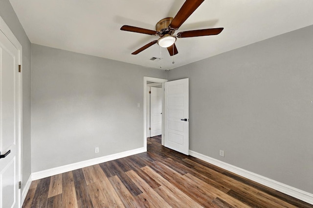 6912 Griggs St, Forest Hill, TX 76140 - unfurnished bedroom with baseboards, dark wood-style flooring, and a ceiling fan