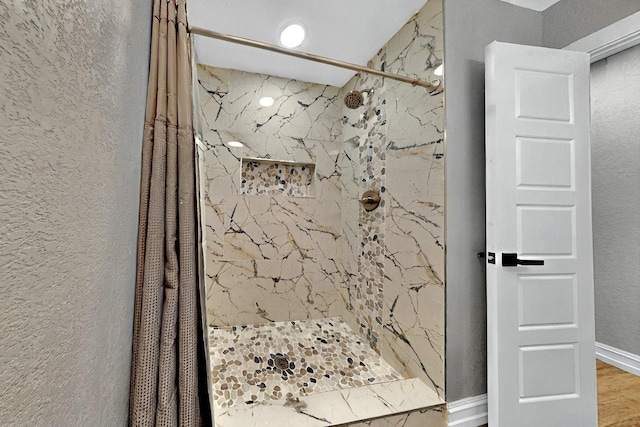 6912 Griggs St, Forest Hill, TX 76140 - bathroom with a marble finish shower and a textured wall