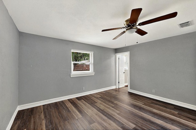 6912 Griggs St, Forest Hill, TX 76140 - spare room with dark wood-style flooring, a ceiling fan, and baseboards