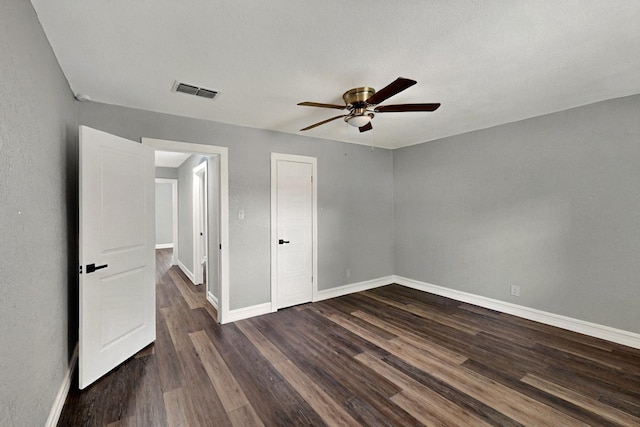6912 Griggs St, Forest Hill, TX 76140 - unfurnished bedroom featuring baseboards, dark wood-style flooring, and ceiling fan