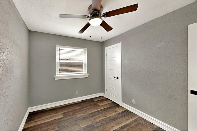 6912 Griggs St, Forest Hill, TX 76140 - empty room with dark wood-type flooring, a textured wall, ceiling fan, and baseboards